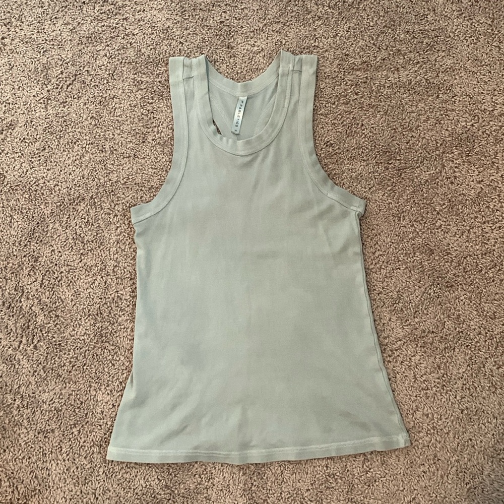 This is a grayish Fabletics workout tank top.